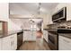 Modern kitchen with granite countertops and stainless steel appliances at 1208 Honey Rd, Apopka, FL 32712