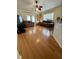 Bright living room with hardwood floors, comfortable seating, and access to patio at 1208 Honey Rd, Apopka, FL 32712