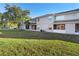 Back exterior view showing a townhome with a screened porch at 13312 Summerton Dr, Orlando, FL 32824