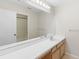 Bathroom with double vanity and large mirror at 13312 Summerton Dr, Orlando, FL 32824