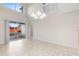 High-ceiling dining room, access to patio and loft at 13312 Summerton Dr, Orlando, FL 32824