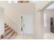 Two-story entryway with stairs and front door at 13312 Summerton Dr, Orlando, FL 32824