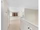 Upstairs hallway with carpet and access to bedrooms at 13312 Summerton Dr, Orlando, FL 32824