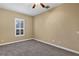 Bright bedroom with neutral walls, carpeting, and ceiling fan at 13607 Zori Ln, Windermere, FL 34786