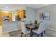Bright dining room with seating for six and easy access to the kitchen at 13607 Zori Ln, Windermere, FL 34786