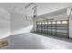 Spacious garage with an automatic door opener and painted floor at 13607 Zori Ln, Windermere, FL 34786