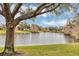 Scenic view of a lake with lush green landscape at 13607 Zori Ln, Windermere, FL 34786