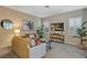 Relaxing living room featuring neutral tones and ample natural light at 13607 Zori Ln, Windermere, FL 34786