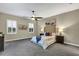 Large main bedroom with a plush bed, window shutters, and tasteful artwork at 13607 Zori Ln, Windermere, FL 34786
