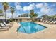Community pool with lounge chairs and a pergola at 13607 Zori Ln, Windermere, FL 34786