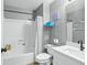 Clean bathroom with a shower/tub combo and white vanity at 142 Santana Pl, Davenport, FL 33897