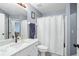 Bathroom featuring a vanity with a quartz countertop and shower at 142 Santana Pl, Davenport, FL 33897