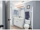 Bathroom with vanity, toilet and a mirror at 142 Santana Pl, Davenport, FL 33897