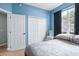 Bedroom with double doors leading to the bathroom at 142 Santana Pl, Davenport, FL 33897
