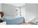 Bedroom with a light blue comforter and double door closet at 142 Santana Pl, Davenport, FL 33897