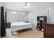 Spacious bedroom with a king-size bed and built-in shelving at 142 Santana Pl, Davenport, FL 33897