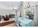 Casual dining area with view into living room and pool at 142 Santana Pl, Davenport, FL 33897