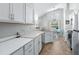 Bright kitchen featuring an island and views to the backyard at 142 Santana Pl, Davenport, FL 33897