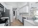 Modern kitchen with stainless steel appliances and ample counter space at 142 Santana Pl, Davenport, FL 33897