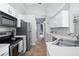 Modern kitchen with stainless steel appliances and ample cabinet space at 142 Santana Pl, Davenport, FL 33897