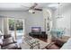 Open living space with access to a pool and dining area at 142 Santana Pl, Davenport, FL 33897