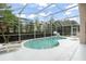 Screened pool with lounge chairs and a basketball hoop at 142 Santana Pl, Davenport, FL 33897