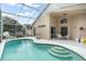 Screened pool and patio with seating area and basketball hoop at 142 Santana Pl, Davenport, FL 33897