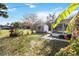 Landscaped backyard view of shed and porch at 1429 Royal Palm Dr, Edgewater, FL 32132