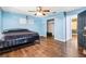 Bedroom with wood floors, large closet and ceiling fan at 1429 Royal Palm Dr, Edgewater, FL 32132