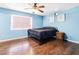 Spacious bedroom with wood floors and ceiling fan at 1429 Royal Palm Dr, Edgewater, FL 32132