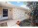 House exterior, front entrance with stone detailing and landscaping at 1429 Royal Palm Dr, Edgewater, FL 32132