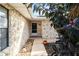 Front entry with stone facade and walkway leading to the front door at 1429 Royal Palm Dr, Edgewater, FL 32132