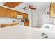 Bright kitchen with wood cabinets, ample counter space, and modern appliances at 1429 Royal Palm Dr, Edgewater, FL 32132