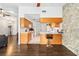 View of kitchen with light wood cabinets, breakfast bar and stone accent wall at 1429 Royal Palm Dr, Edgewater, FL 32132