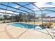 Enclosed pool area with rock waterfall feature at 1429 Royal Palm Dr, Edgewater, FL 32132