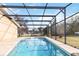 Inviting screened pool with clear water at 1429 Royal Palm Dr, Edgewater, FL 32132