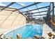 Inviting screened pool with a large patio area at 1429 Royal Palm Dr, Edgewater, FL 32132