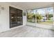 Screened porch with sliding glass door access at 1429 Royal Palm Dr, Edgewater, FL 32132