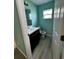 Small bathroom with toilet and vanity at 1526 Providence Rd, Lakeland, FL 33805