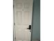 White bedroom door with a keypad lock at 1526 Providence Rd, Lakeland, FL 33805