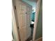 Bedroom door with a view of a bed and carpeted floor at 1526 Providence Rd, Lakeland, FL 33805
