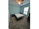 Simple bedroom with a bed, nightstands, and ceiling fan at 1526 Providence Rd, Lakeland, FL 33805