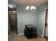 Dining area with a table and chairs, hardwood floors, and a chandelier at 1526 Providence Rd, Lakeland, FL 33805