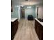 Light and airy dining area with a small table and chairs, and hardwood floors at 1526 Providence Rd, Lakeland, FL 33805