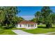 Newly constructed home with a well-manicured lawn and a paved driveway at 1526 Providence Rd, Lakeland, FL 33805