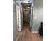 Clean hallway with light walls and hardwood flooring at 1526 Providence Rd, Lakeland, FL 33805