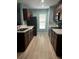 Modern kitchen featuring dark brown cabinets and light-colored countertops at 1526 Providence Rd, Lakeland, FL 33805