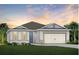 Attractive one-story home with a two-car garage and well-manicured lawn at 1833 Groveline Rd, Saint Cloud, FL 34771