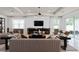 Open living space featuring a sectional sofa and built-in shelving at 1833 Groveline Rd, Saint Cloud, FL 34771
