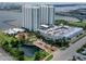 Aerial view of the condo complex, parking, and waterfront at 241 Riverside Drive # 409, Daytona Beach, FL 32117